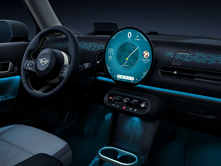 View of the interior of the MINI Cooper with ambient light in blue.