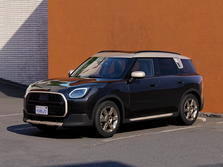 Front side view of the MINI Countryman in Midnight Black and Vibrant Silver roof parking.